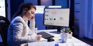 Two business professionals discussing the best technology expense management software